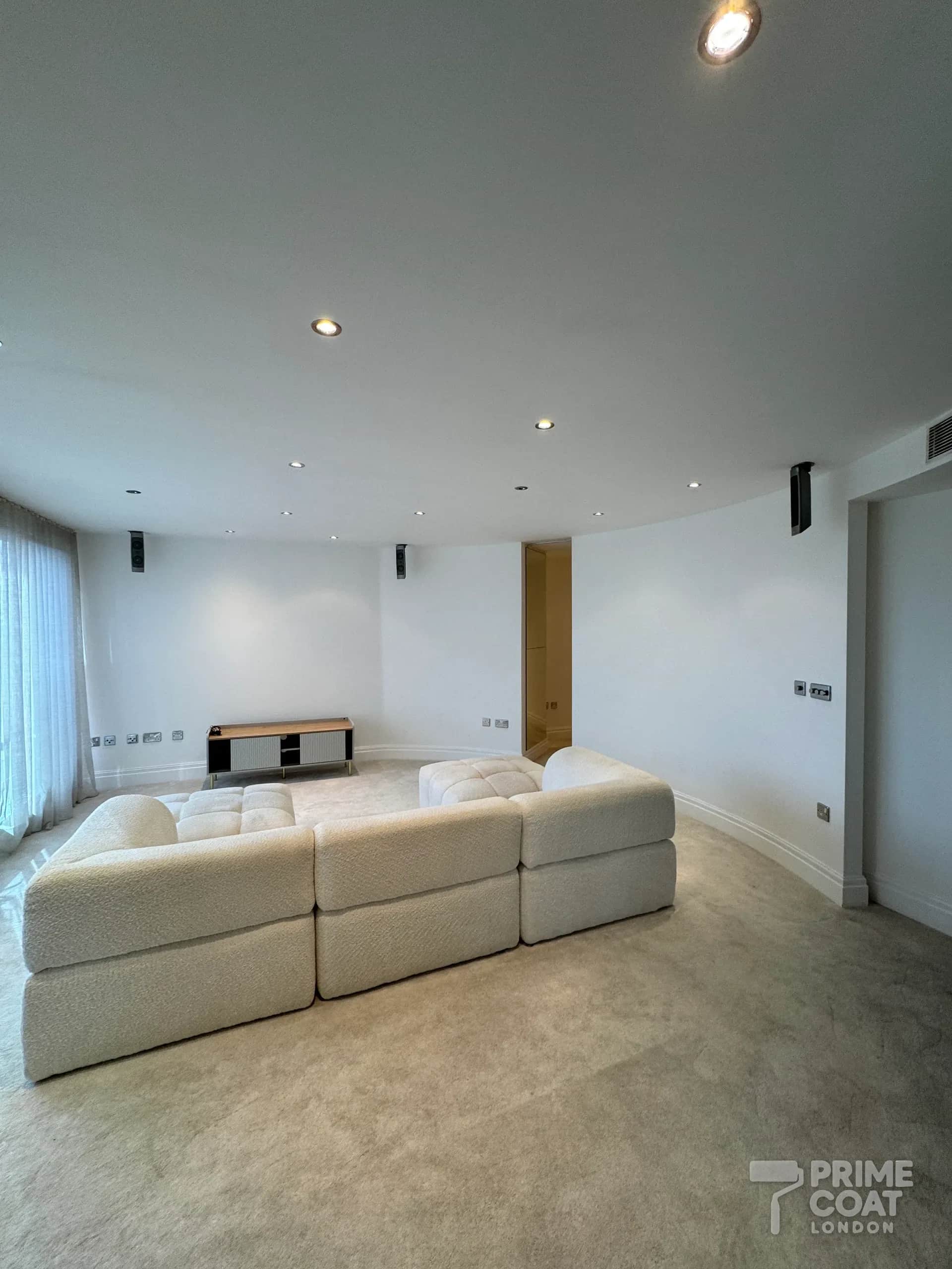 Chelsea Harbour SW10 living room after repainting — curved walls repainted from taupe to clean white